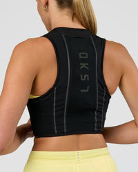 Woman wearing Pace Running Vest - Black-Reflective | Model:Evie | Size:XS/S | Thumbnail Index: 8