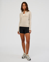 Woman wearing AeroFLX+ Long Sleeve Half Zip - Shale Beige/Shale Beige | Model:Dakota | Size:XS | Thumbnail Index: 1