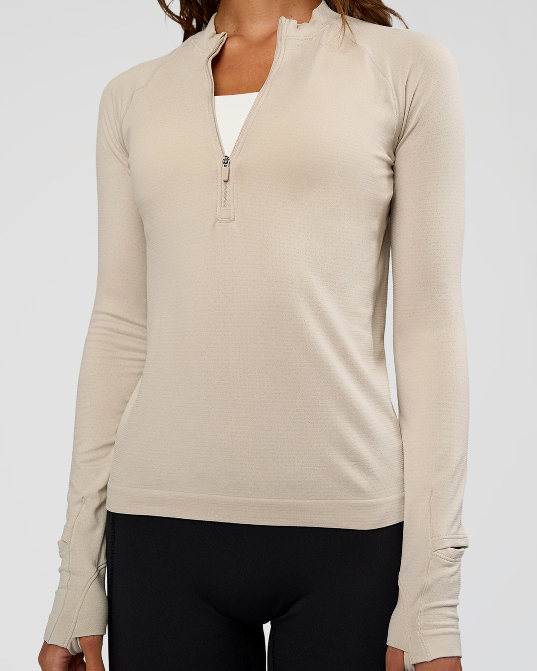 Woman wearing AeroFLX+ Long Sleeve Half Zip - Shale Beige/Shale Beige | Model:Dakota | Size:XS - view 4