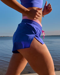 Campaign image of Accelerate Synergy 3" Running Short Short - Power Cobalt-Pink Rose | Thumbnail Index: 6
