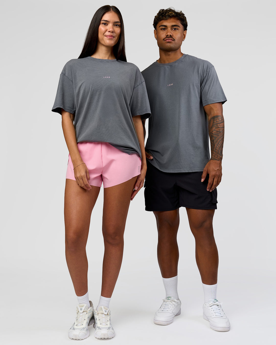 Duo wearing Built On Values FLXCotton Oversized Tee - Dark Storm Washed-Pink Rose | Model:Xav | Size:L | Model:Rhiley | Size:XS - view 4
