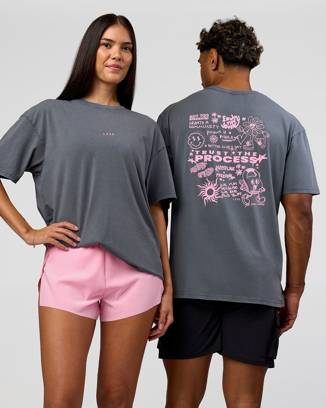 Duo wearing Built On Values FLXCotton Oversized Tee - Dark Storm Washed-Pink Rose | Model:Xav | Size:L | Model:Rhiley | Size:XS