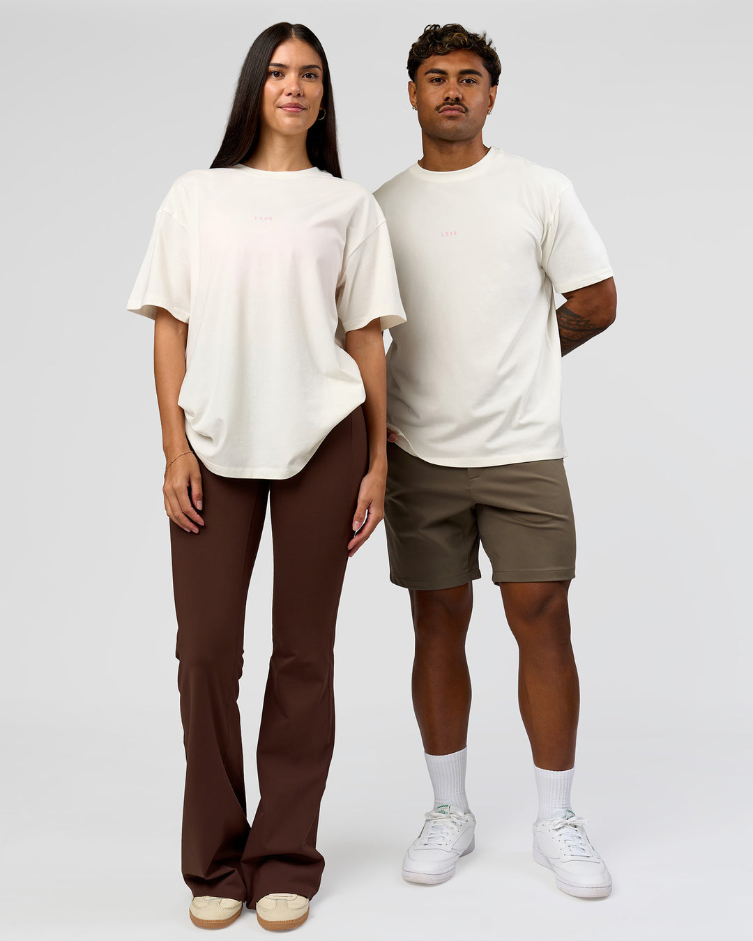 Duo wearing Built On Values FLXCotton Oversized Tee - Off White-Pink Rose | Model:Xav | Size:L | Model:Rhiley | Size:XS - view 8