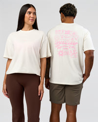 Duo wearing Built On Values FLXCotton Oversized Tee - Off White-Pink Rose | Model:Xav | Size:L | Model:Rhiley | Size:XS | Thumbnail Index: 0