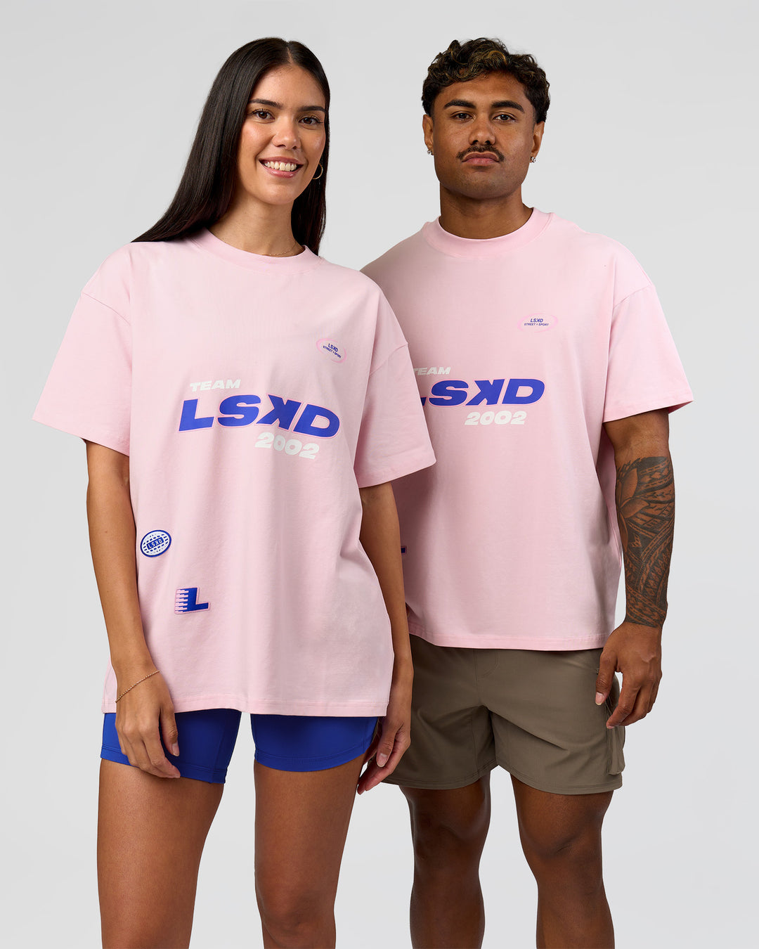 Duo wearing League Heavyweight FLXCotton Oversized Tee - Marshmallow-Power Cobalt | Model:Xav | Size:L | Model:Rhiley | Size:XS - view 1