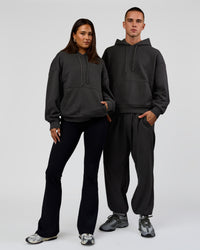 Duo wearing Base Oversized DC Hoodie - Onyx | Model:Albert | Size:M | Model:Bianca | Size:XS | Thumbnail Index: 3