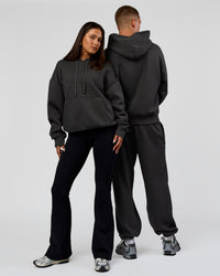 Duo wearing Base Oversized DC Hoodie - Onyx | Model:Albert | Size:M | Model:Bianca | Size:XS | Thumbnail Index: 6