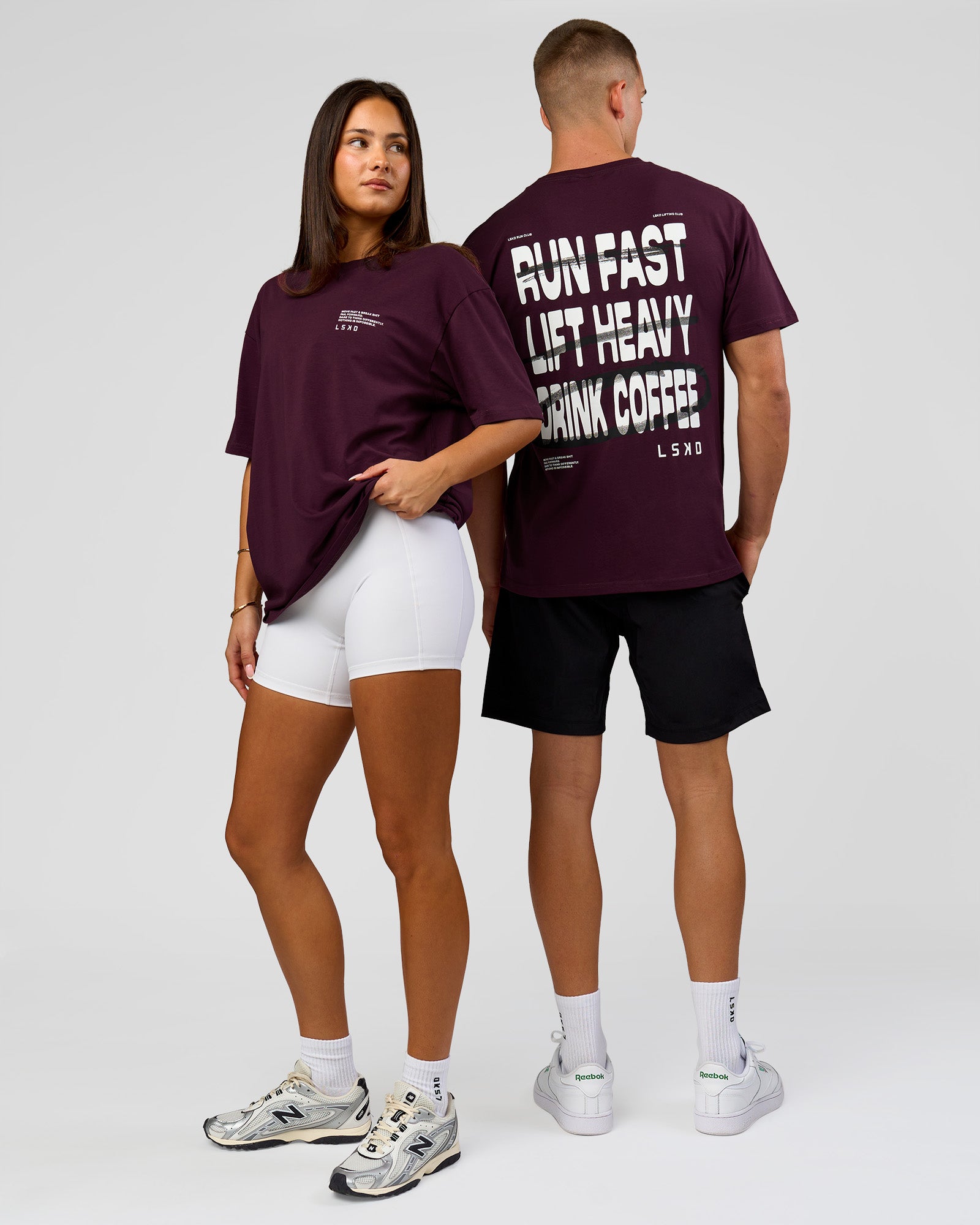 Duo wearing Coffee Run FLXCotton Oversized Tee - Cherry Lacquer-Black | Model:Albert | Size:M | Model:Bianca | Size:XS