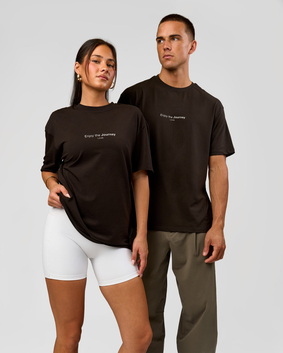 Duo wearing VS1 Enjoy The Journey FLXCotton Oversize Tee - Ground Coffee | Model:Albert | Size:M | Model:Bianca | Size:XS - view 3