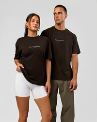 Duo wearing VS1 Enjoy The Journey FLXCotton Oversize Tee - Ground Coffee | Model:Albert | Size:M | Model:Bianca | Size:XS | Thumbnail Index: 2