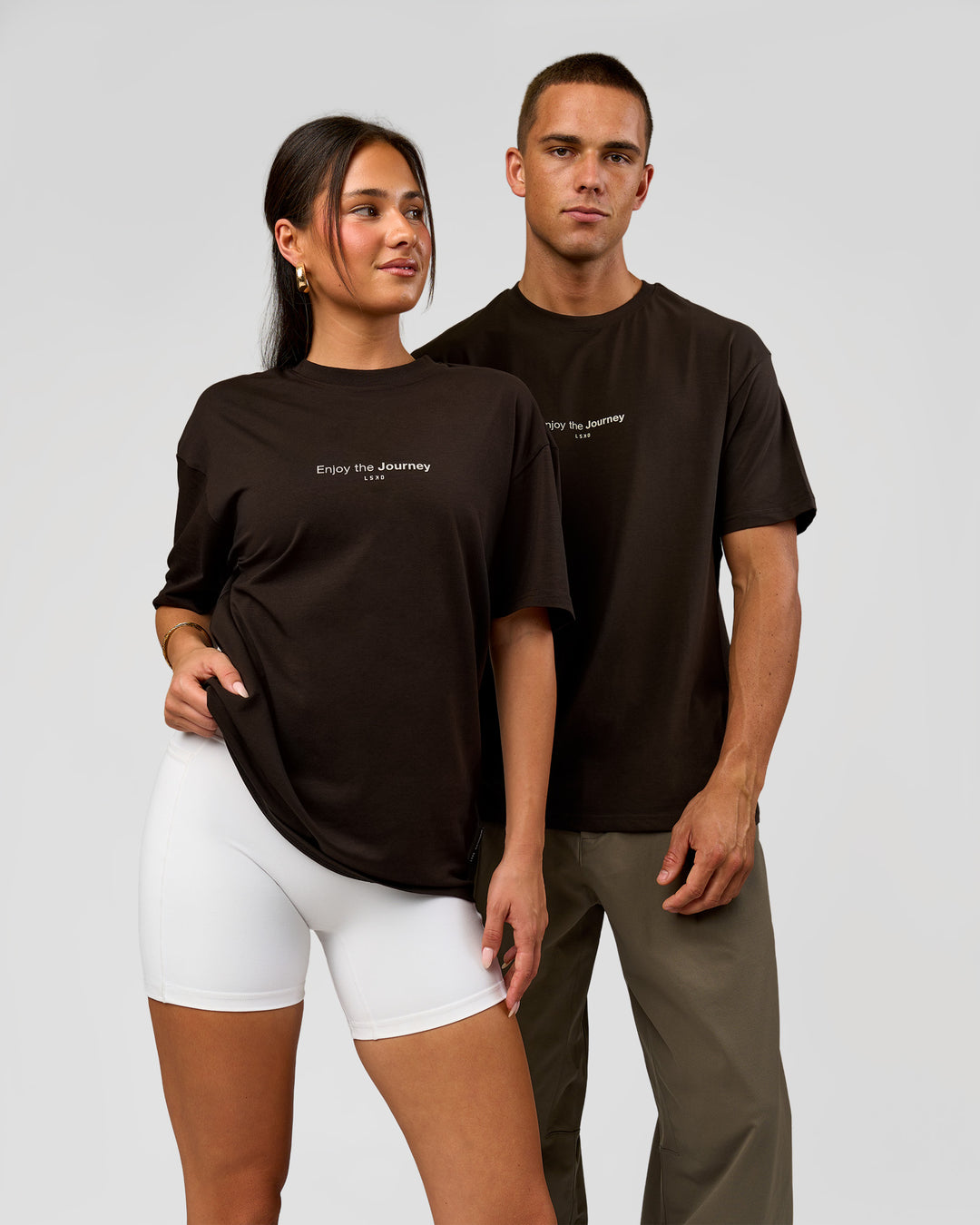Duo wearing VS1 Enjoy The Journey FLXCotton Oversize Tee - Ground Coffee | Model:Albert | Size:M | Model:Bianca | Size:XS - view 1