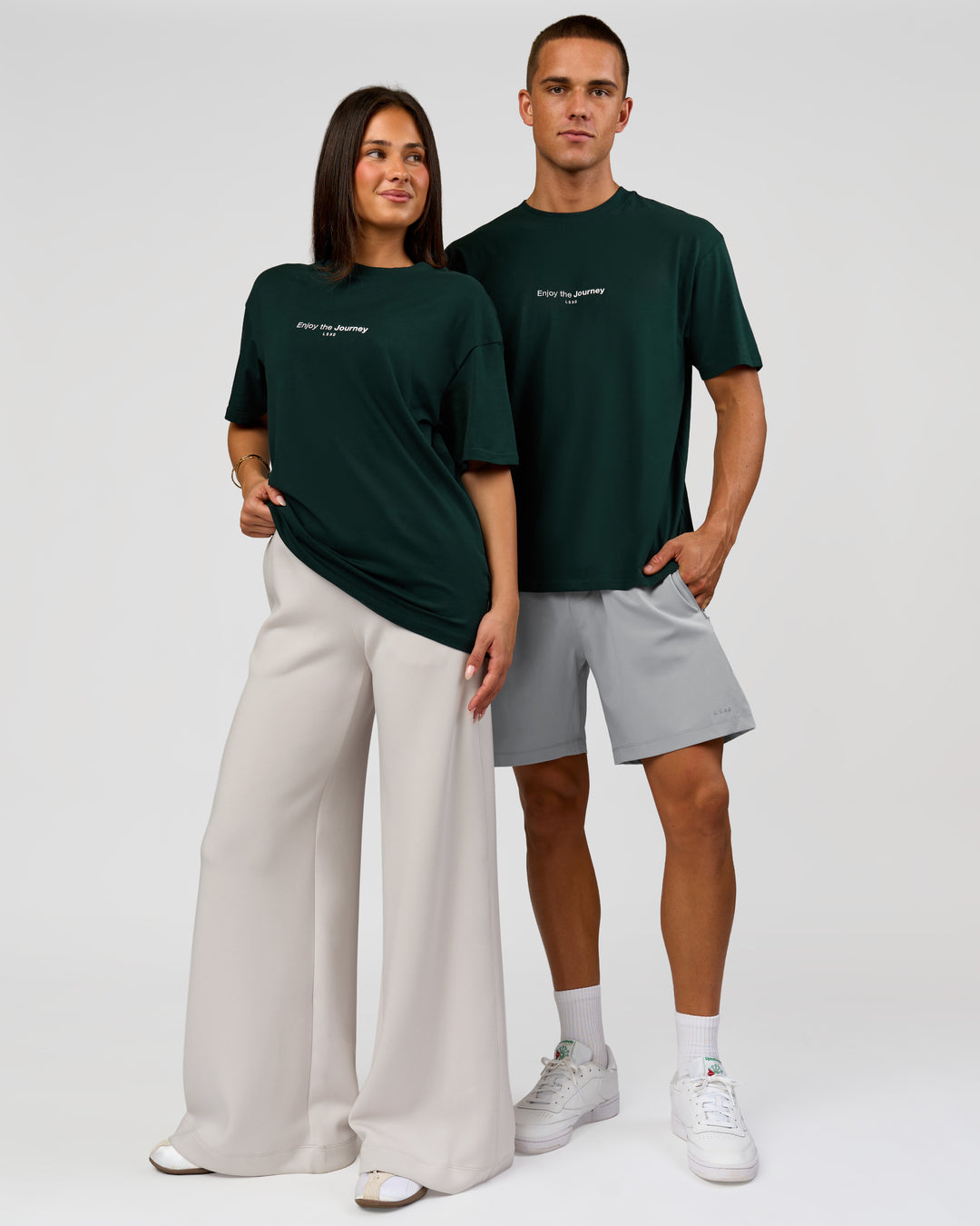 Duo wearing VS1 Enjoy The Journey FLXCotton Oversize Tee - Midnight Green | Model:Albert | Size:M | Model:Bianca | Size:XS - view 4