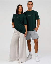 Duo wearing VS1 Enjoy The Journey FLXCotton Oversize Tee - Midnight Green | Model:Albert | Size:M | Model:Bianca | Size:XS | Thumbnail Index: 3