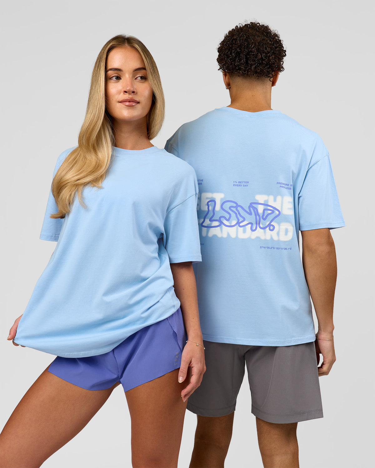 Duo wearing Benchmark FLXCotton Oversized Tee - Open Air-Blue Bell | Model:Leandro | Size:M | Model:Issy | Size:XS