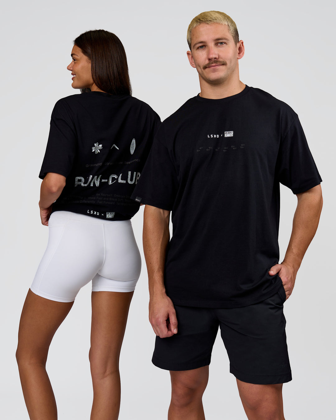 Duo wearing Deadly Runners Run Club FLXCotton Oversize Tee - Black | Model:Bella | Size:S | Model:Jaiden | Size:M - view 1