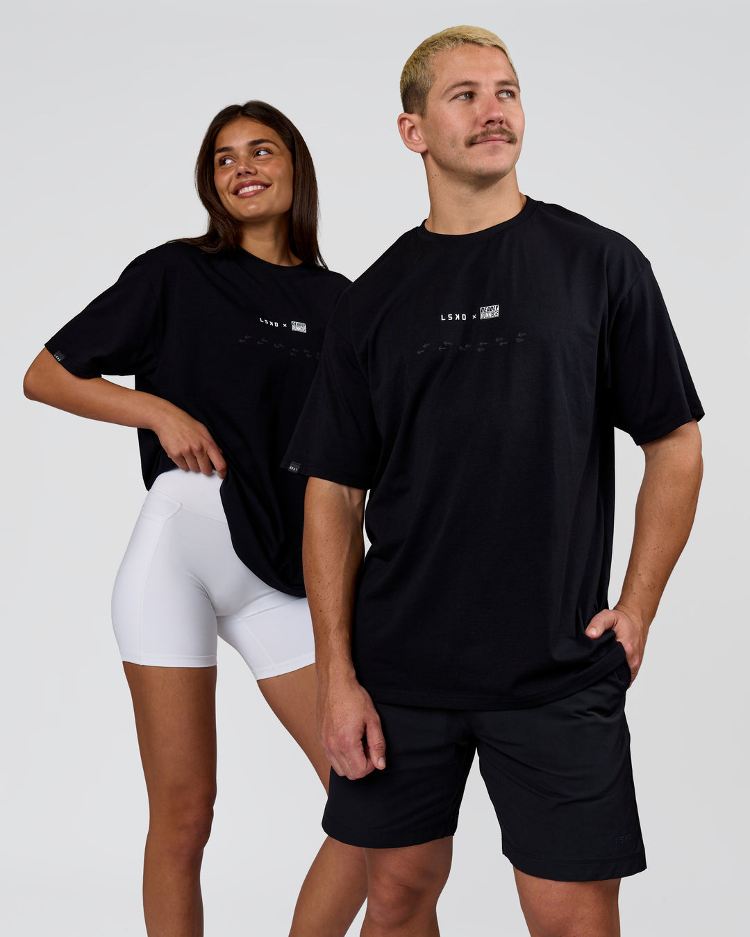 Duo wearing Deadly Runners Run Club FLXCotton Oversize Tee - Black | Model:Bella | Size:S | Model:Jaiden | Size:M - view 11