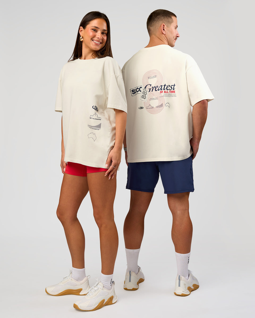 Duo wearing Greatest of All Time Heavyweight FLXCotton Oversized Tee - Off White Washed-Scarlet | Model:Bianca | Size:XS | Model:Jaiden | Size:L - view 21