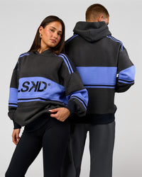 Duo wearing A-Team Oversized Hoodie - Onyx-Bluebell | Model:Bianca | Size:XS | Model:Albert | Size:M | Thumbnail Index: 0