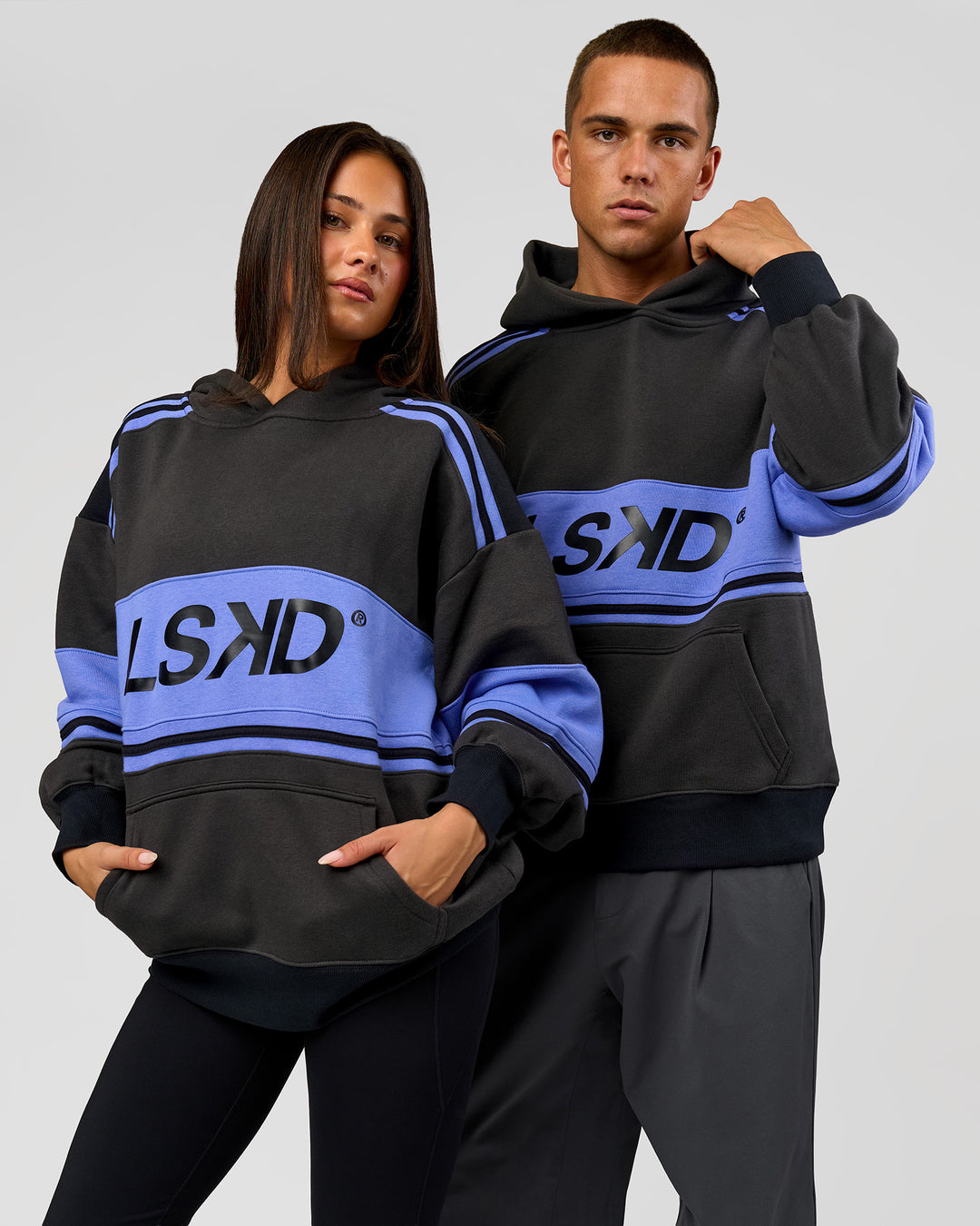 Duo wearing A-Team Oversized Hoodie - Onyx-Bluebell | Model:Bianca | Size:XS | Model:Albert | Size:M - view 3