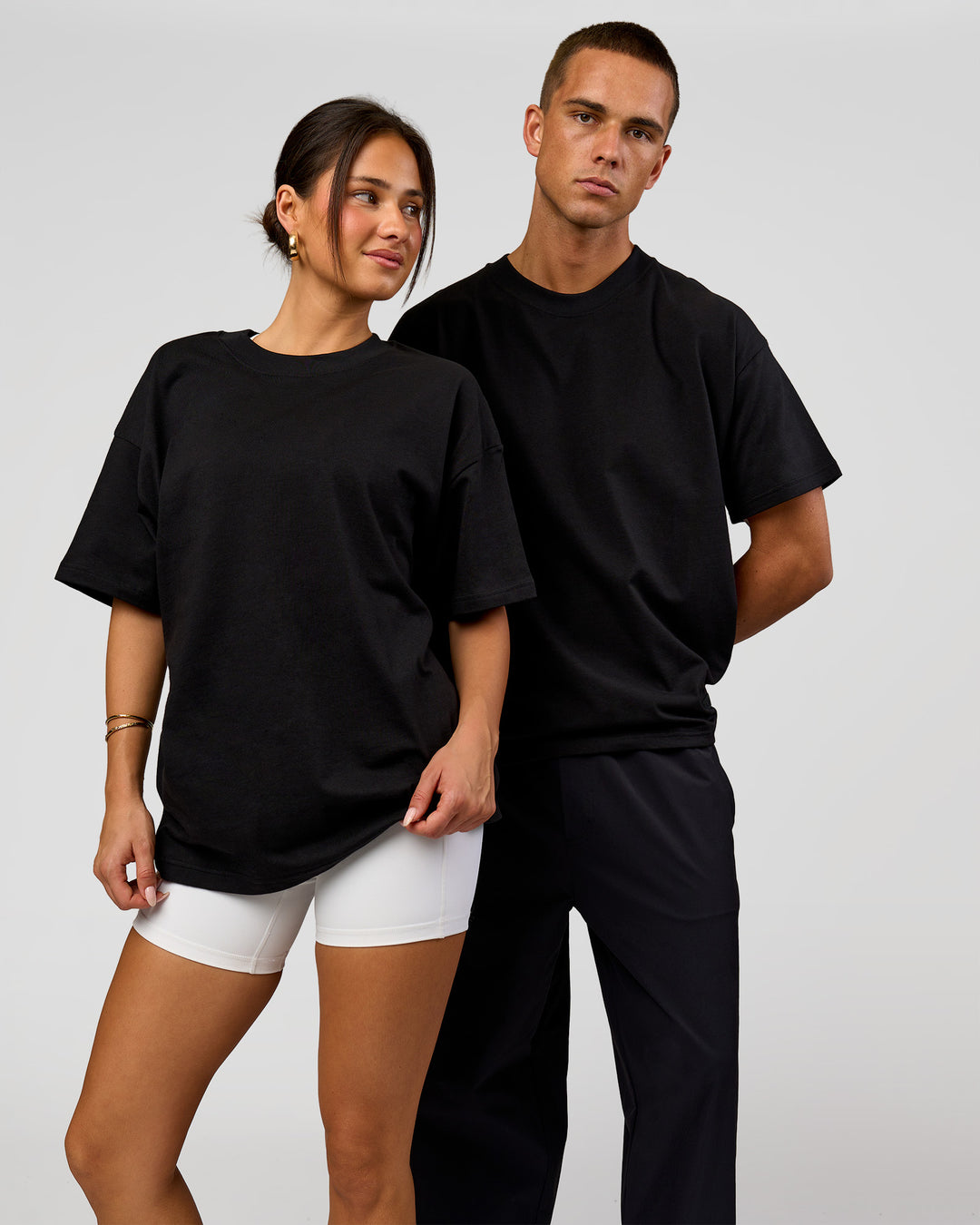 Duo wearing Tonal Legacy Heavyweight Oversized Tee - Black-Black | Model:Bianca | Size:XS | Model:Albert | Size:M - view 7