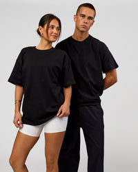 Duo wearing Tonal Legacy Heavyweight Oversized Tee - Black-Black | Model:Bianca | Size:XS | Model:Albert | Size:M | Thumbnail Index: 6