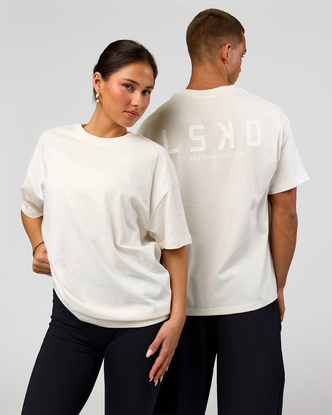 Duo wearing Tonal Legacy Heavyweight Oversized Tee - Off White-Off White | Model:Bianca | Size:XS | Model:Albert | Size:M - view 1