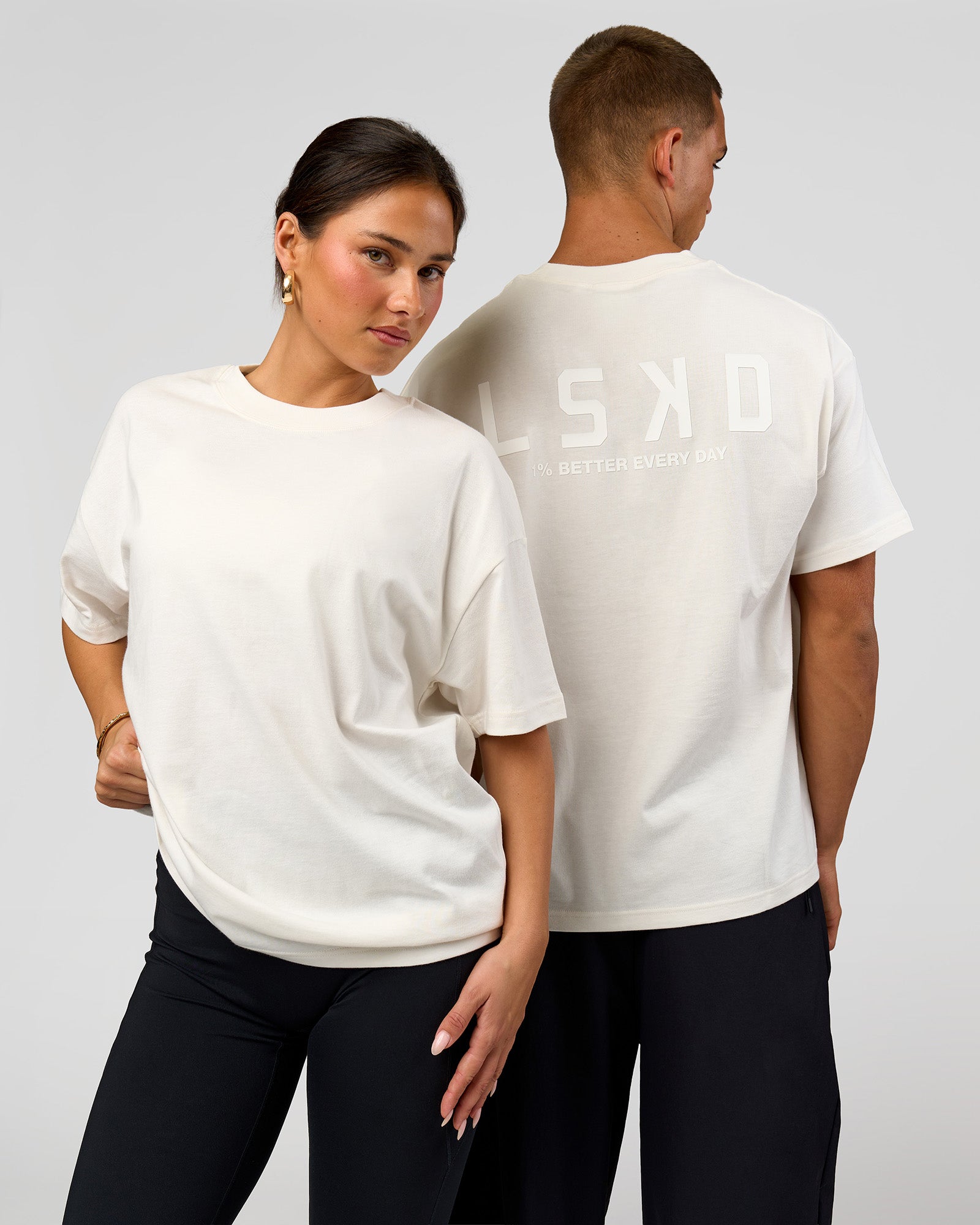 Duo wearing Tonal Legacy Heavyweight Oversized Tee - Off White-Off White | Model:Bianca | Size:XS | Model:Albert | Size:M