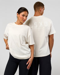 Duo wearing Tonal Legacy Heavyweight Oversized Tee - Off White-Off White | Model:Bianca | Size:XS | Model:Albert | Size:M | Thumbnail Index: 0