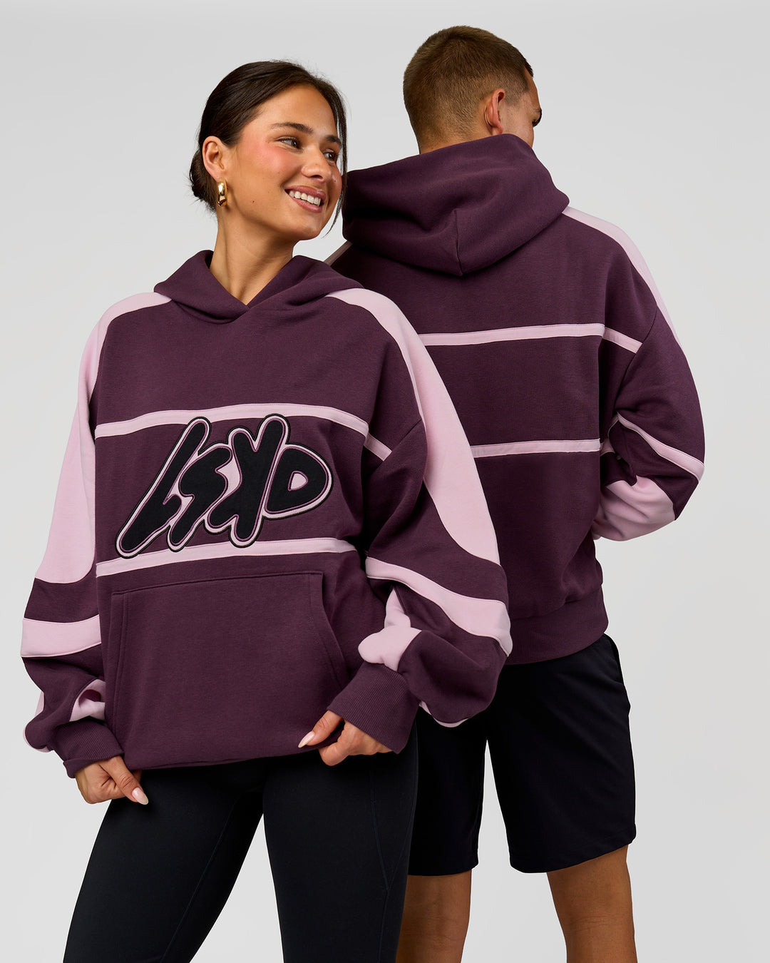 Duo wearing Vibe Oversized Hoodie - Midnight Plum-Marshmallow | Model:Bianca | Size:XS | Model:Albert | Size:M - view 1