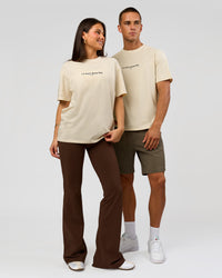 Duo wearing VS6 1% Better FLXCotton Oversize Tee - Vanilla Bean | Model:Bianca | Size:XS | Model:Albert | Size:M | Thumbnail Index: 3