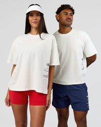 Duo wearing Greatest of All Time Heavyweight FLXCotton Boxed Tee - Off White Washed | Model:Rhiley| Size:XS | Model:Xav | Size:L | Thumbnail Index: 2