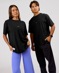 Duo wearing VS26 1% Better FLXCotton Oversize Tee - Black-White | Model:Charli | Size:XS | Model:George | Size:M | Thumbnail Index: 3
