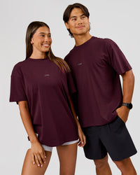 Duo wearing VS26 1% Better FLXCotton Oversize Tee - Cherry Lacquer-Off White | Model:Charli | Size:XS | Model:George | Size:M | Thumbnail Index: 3