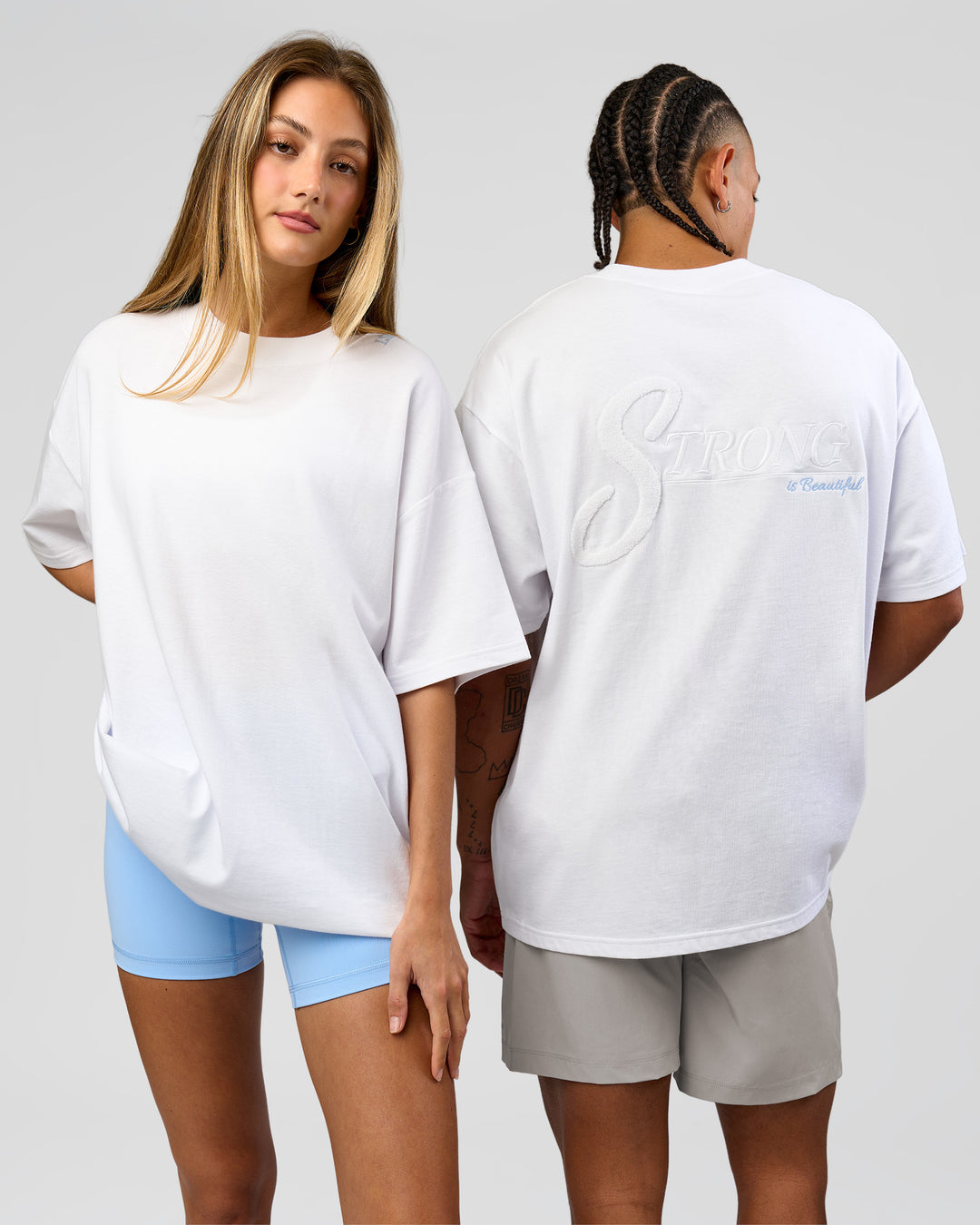 Duo wearing Strong is Beautiful Heavyweight Oversized Tee - White | Model:Georgia | Size:XS | Model:Malebo | Size:M - view 1