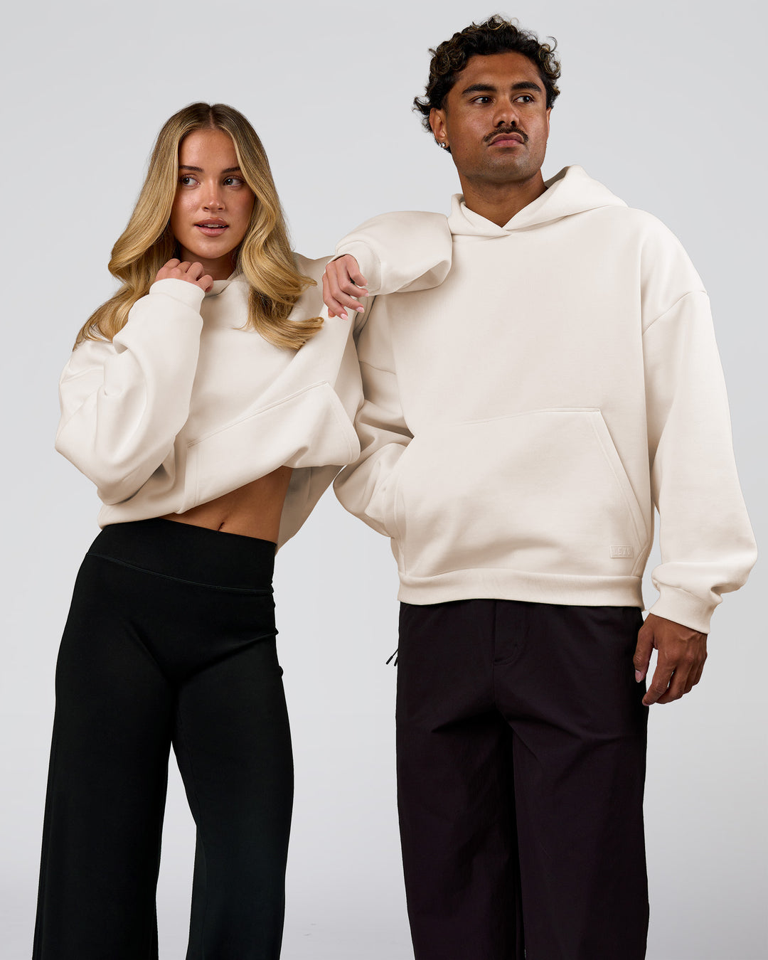 Duo wearing Tonal Legacy Boxy Hoodie - Off White-Off White | Model:Issy | Size:XS | Model:Xav | Size:L - view 4