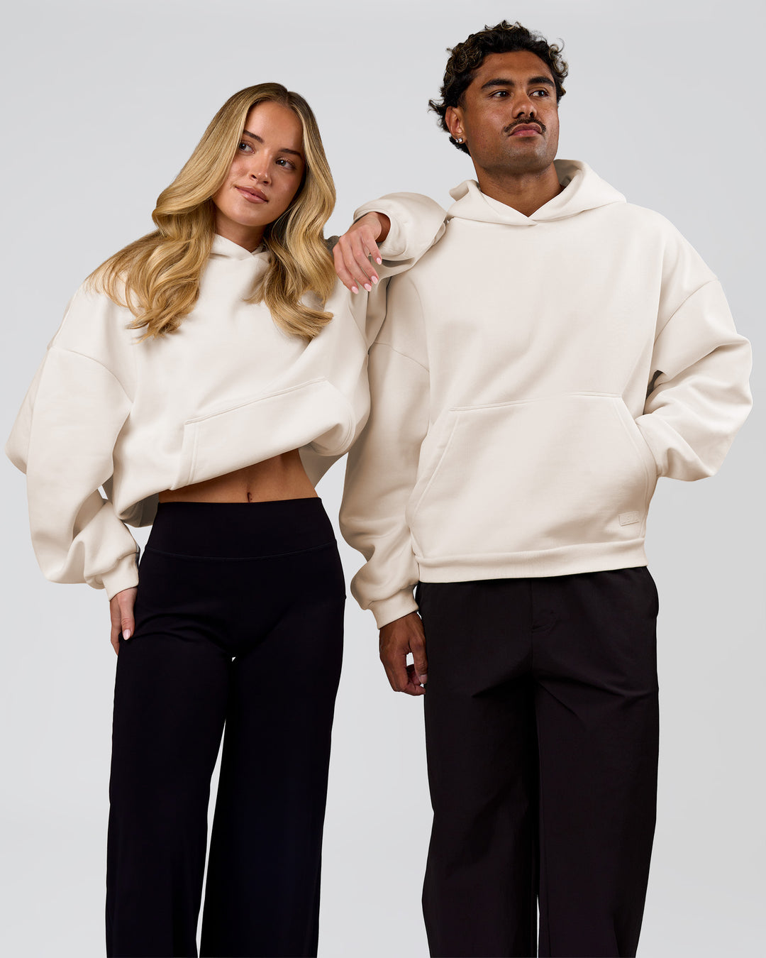Duo wearing Tonal Legacy Boxy Hoodie - Off White-Off White | Model:Issy | Size:XS | Model:Xav | Size:L - view 10