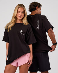 Duo wearing Values Manifesto Heavyweight Oversized Tee  - Black-White | Model:Issy | Size:XS | Model:Xav | Size:L | Thumbnail Index: 0