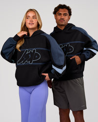 Duo wearing Vibe Oversized Hoodie - Black-Future Navy | Model:Issy | Size:XS | Model:Xav | Size:L | Thumbnail Index: 0