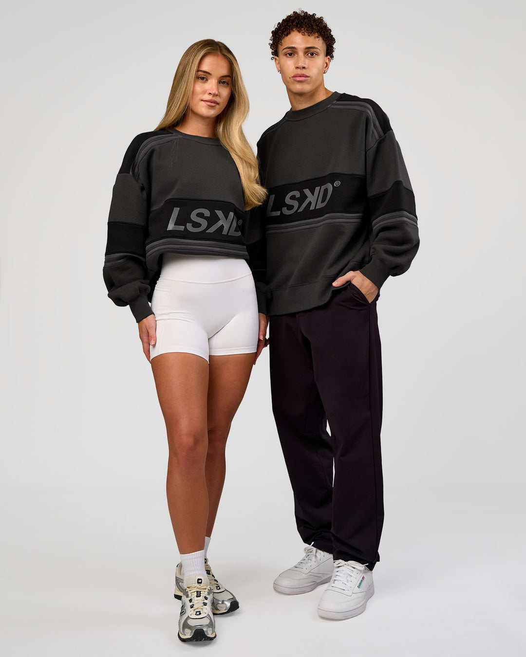 Duo wearing A-Team Sweater Oversize - Onyx-Black | Model:Issy | Size:XS | Model:Leandro | Size:M - view 4