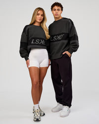 Duo wearing A-Team Sweater Oversize - Onyx-Black | Model:Issy | Size:XS | Model:Leandro | Size:M | Thumbnail Index: 3