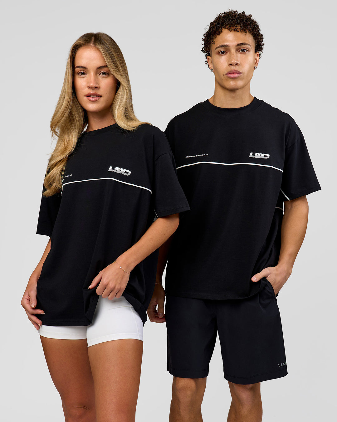 Duo wearing Inline Heavyweight FLXCotton Oversized Tee - Black-White | Model:Issy | Size:XS | Model:Leandro | Size:M - view 2