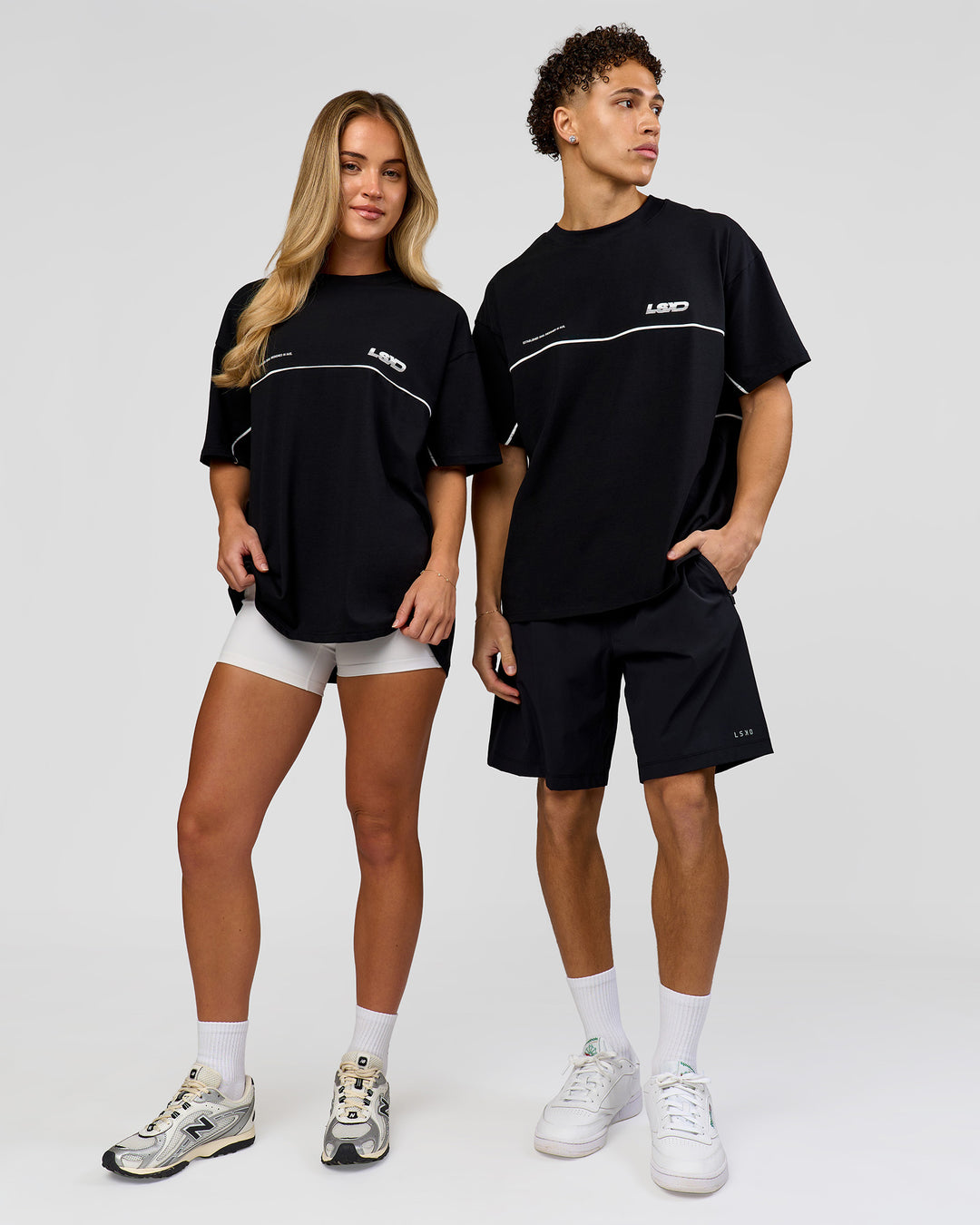 Duo wearing Inline Heavyweight FLXCotton Oversized Tee - Black-White | Model:Issy | Size:XS | Model:Leandro | Size:M - view 3