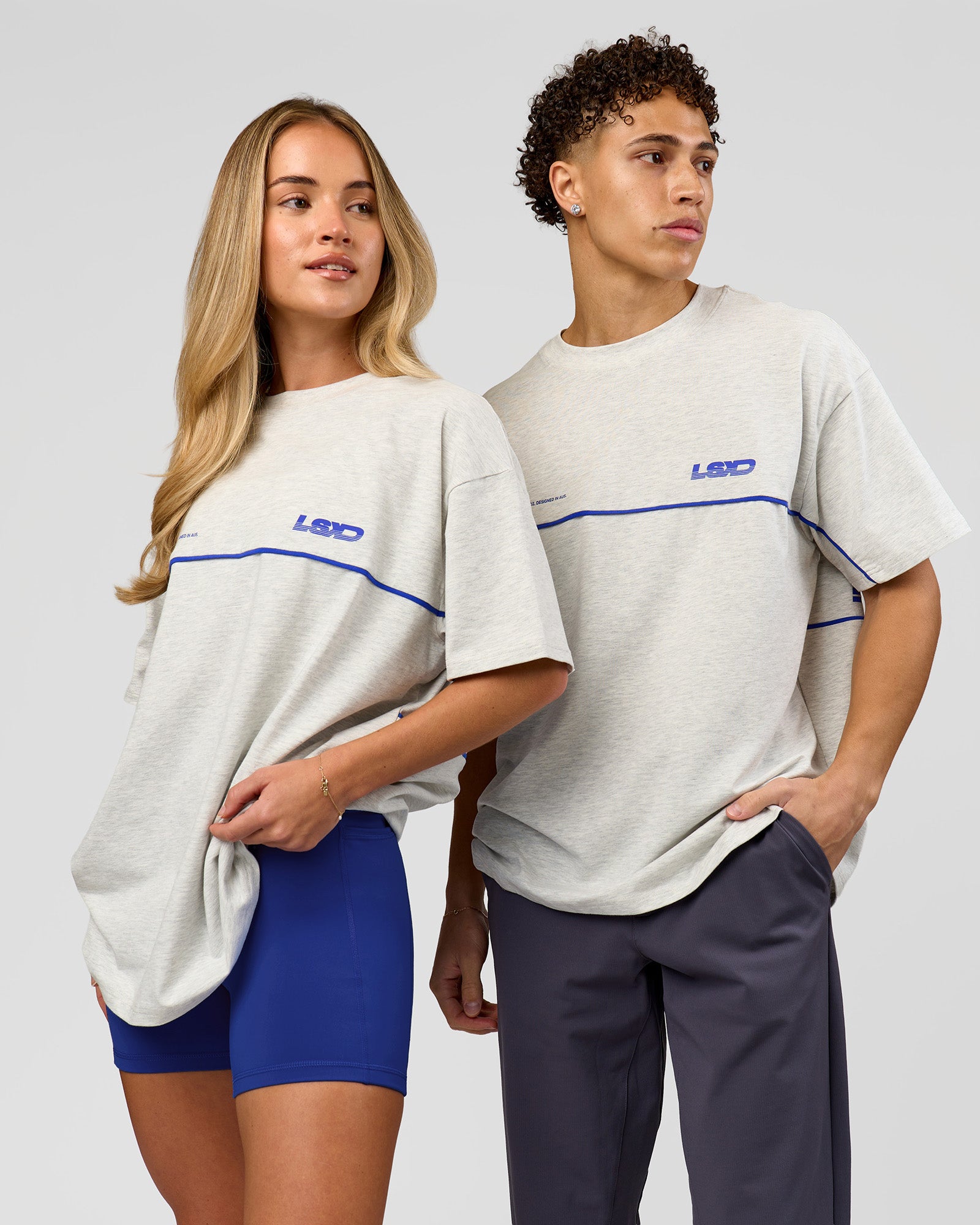 Duo wearing Inline Heavyweight FLXCotton Oversized Tee - Silver Marl-Power Cobalt | Model:Issy | Size:XS | Model:Leandro | Size:M