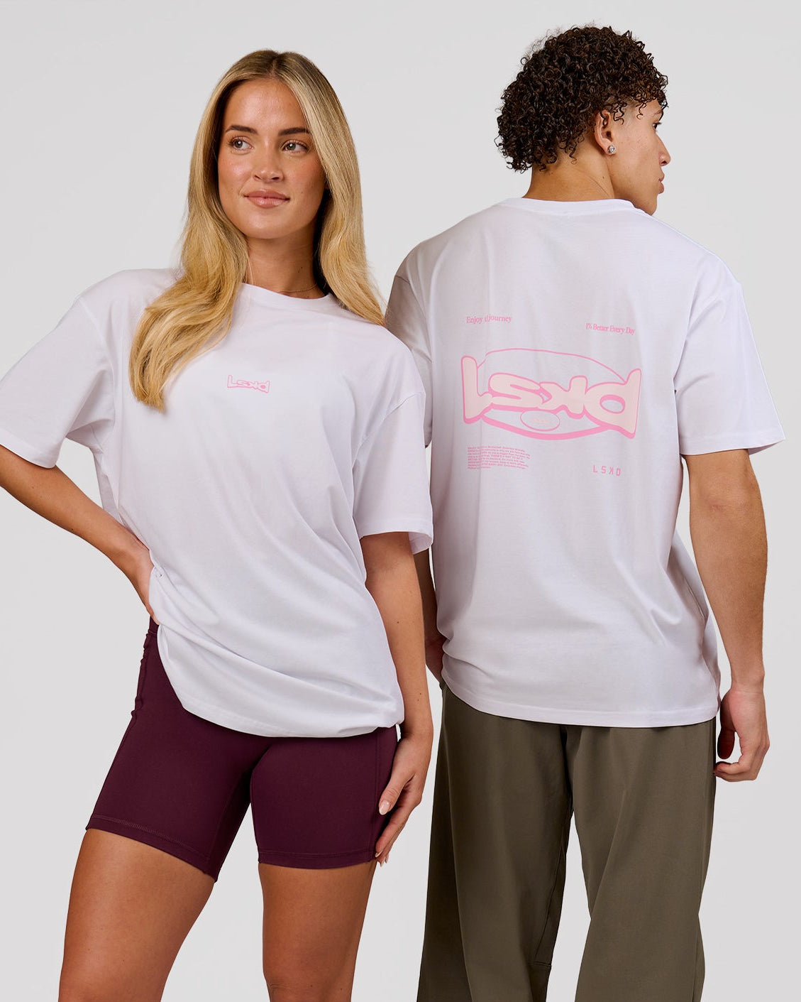 Duo wearing Magma FLXCotton Oversize Tee  - White-Pink Rose | Model:Issy | Size:XS | Model:Leandro | Size:M - view 1