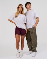 Duo wearing Magma FLXCotton Oversize Tee  - White-Pink Rose | Model:Issy | Size:XS | Model:Leandro | Size:M | Thumbnail Index: 3
