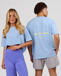 Duo wearing VS26 Journey FLXCotton Oversize Tee - Open Air-Lemon | Model:Issy | Size:XS | Model:Leandro | Size:M | Thumbnail Index: 0