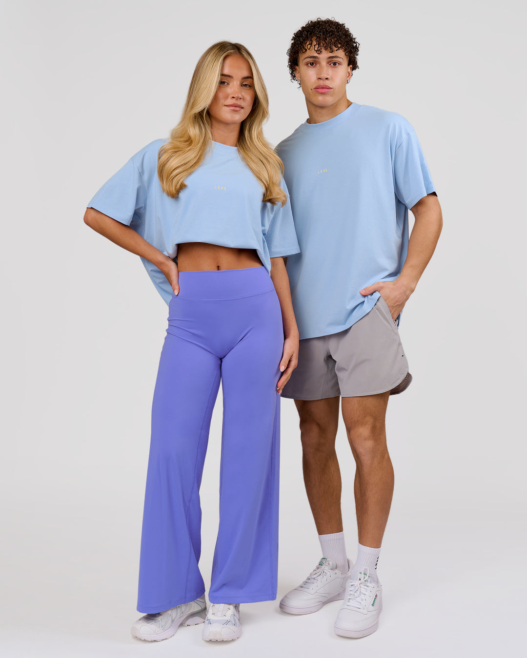 Duo wearing VS26 Journey FLXCotton Oversize Tee - Open Air-Lemon | Model:Issy | Size:XS | Model:Leandro | Size:M - view 5
