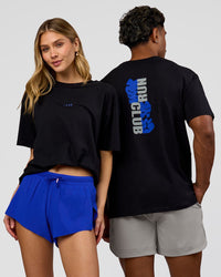 Duo wearing Run Club Elevate FLXCotton Oversized Tee - Black-Electric Indigo | Model:Leilani | Size:XS | Model:Xav | Size:L | Thumbnail Index: 0