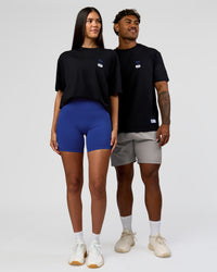 Duo wearing Archive FLXCotton Oversized Tee - Black-Electric Indigo | Model:Rhiley | Size:XS | Model:Xav | Size:L | Thumbnail Index: 6