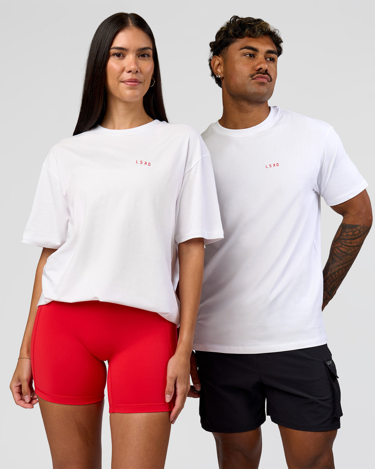 Duo wearing Dare To Think FLXCotton Tee Oversize - White-Scarlet | Model:Rhiley | Size:XS | Model:Xav | Size:L